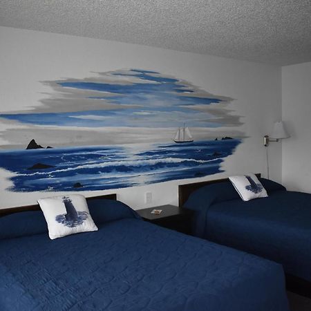 Lighthouse Cove Inn Bandon Exterior foto A room at the motel